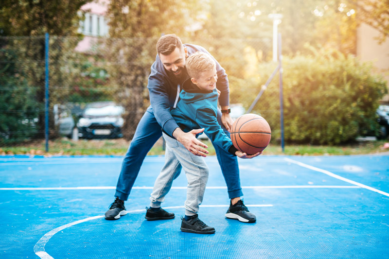 Father and Son playing basketball