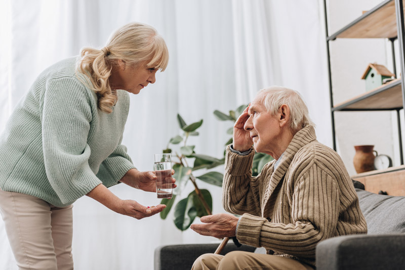 Elderly man taking medication for memory loss