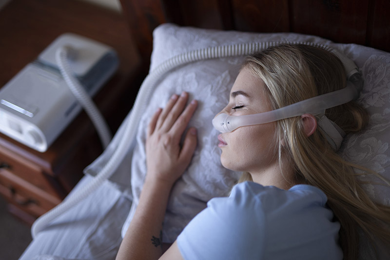 Sleeping with breathing machine