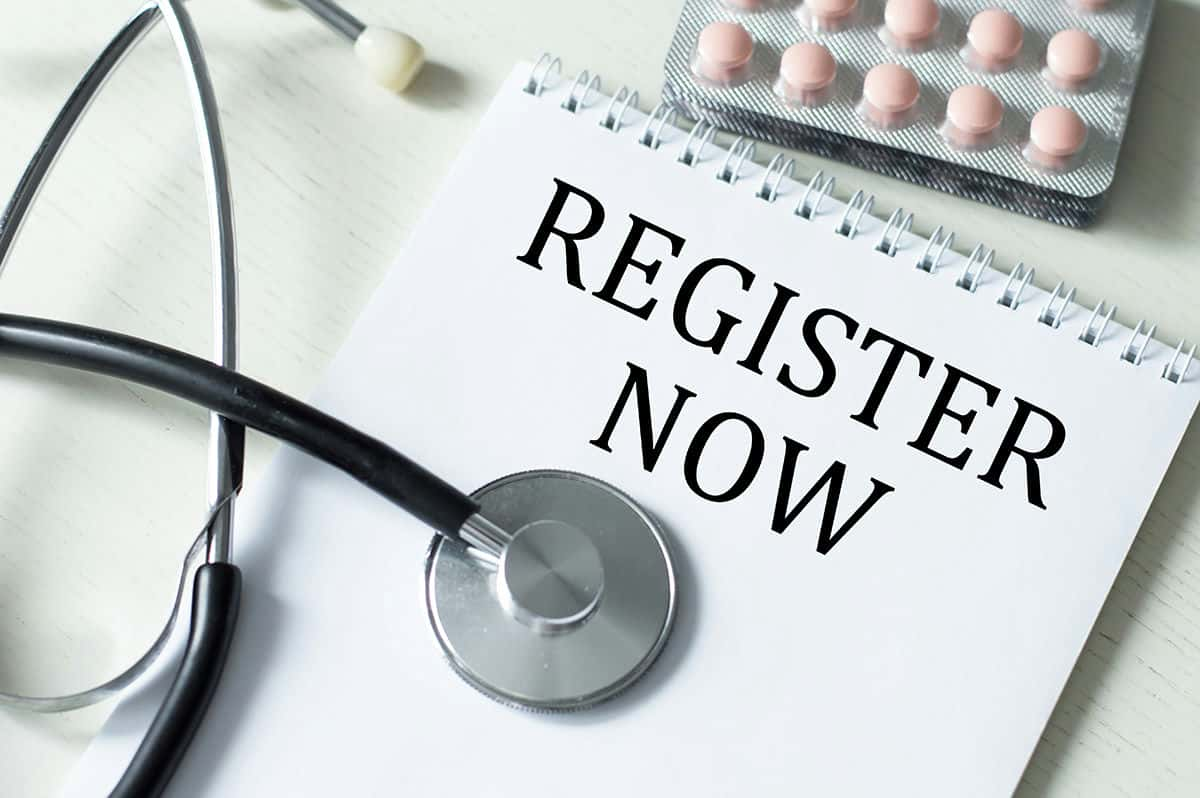 Stethoscope and a clipboard that says "register now"